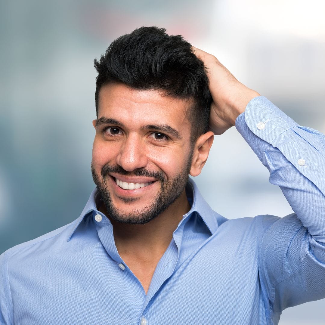 Man with healthy scalp and hair using Keravive treatment